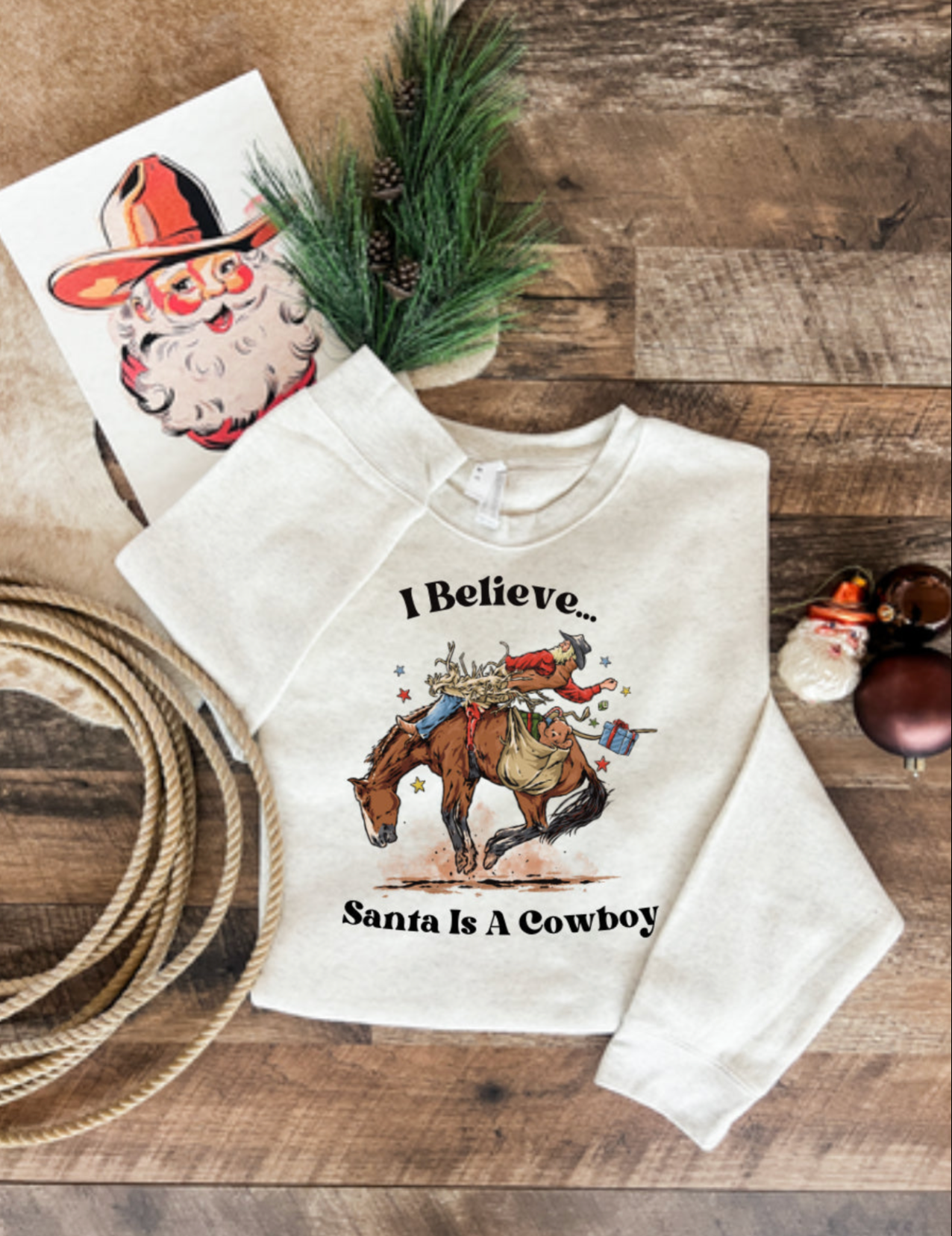I Believe Santa Is A Cowboy Sweatshirt or Tee  (Heather Cream)